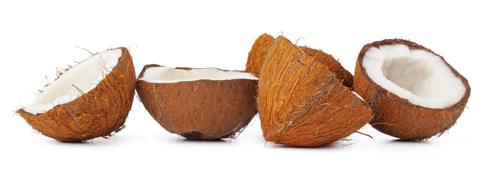 Pieces of a coconut on white background