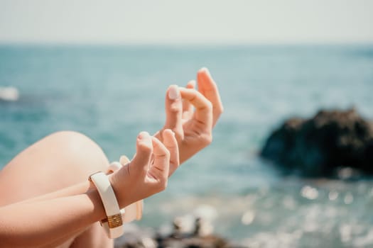 Close up Hand Gesture of Woman Doing an Outdoor Lotus Yoga Position. Close up. Blurred background