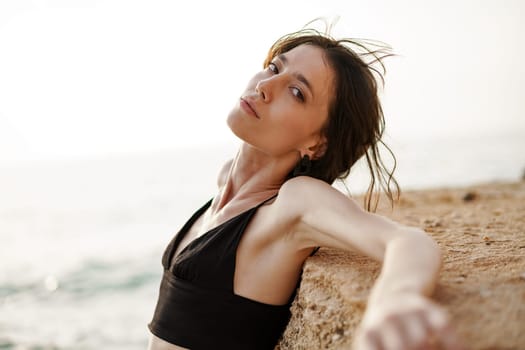 Young smiling woman outdoors portrait at the beach