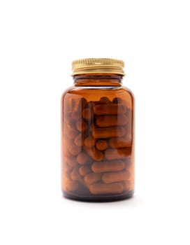 Isolated Brown Glass Bottle With Softgel Capsules OF Slippery Elm On Whitet Background, Copy Space for Text. Herbal Supplement, Ulmus Fulva, Natural Remedy. Vertical plane.