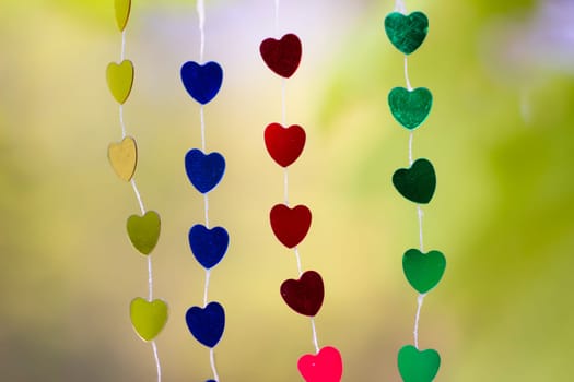 Colored shiny hearts hanging garland for Valentine's Day