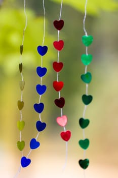 Colored shiny hearts hanging garland for Valentine's Day