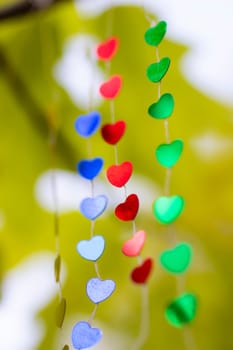 Colored shiny hearts hanging garland for Valentine's Day