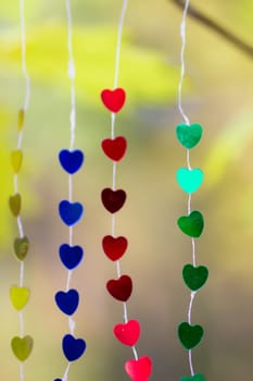 Colored shiny hearts hanging garland for Valentine's Day