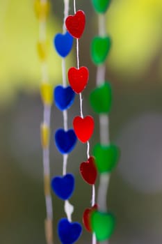 Colored shiny hearts hanging garland for Valentine's Day