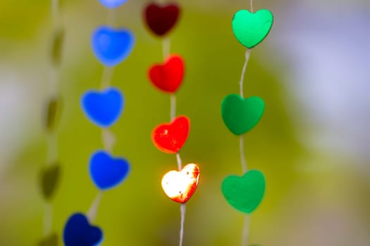 Colored shiny hearts hanging garland for Valentine's Day