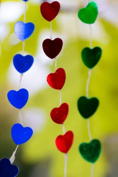 Colored shiny hearts hanging garland for Valentine's Day