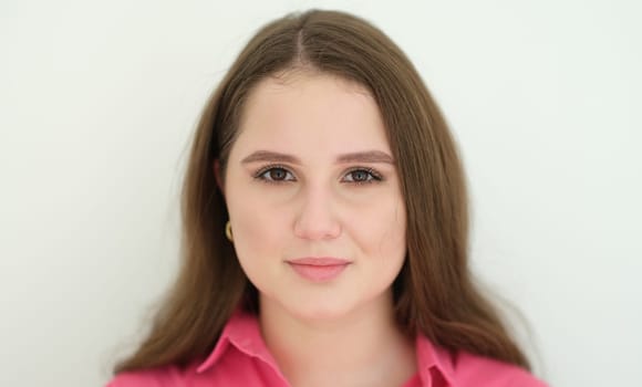Portrait of young beautiful woman with dark long hair. Ordinary people concept