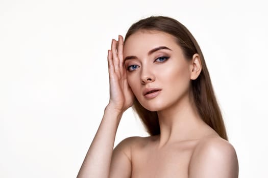 portrait of beautiful young woman with perfect skin on white background. copy space