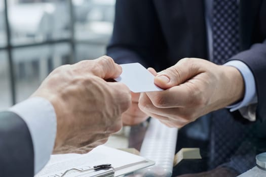 close-up. businessman gives business partner his business card