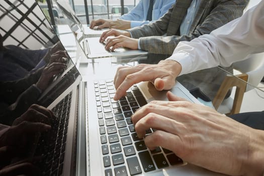 man working at office hand on keyboard close up