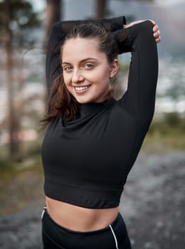A workout outdoors invigorates the soul. Cropped portrait of an attractive young woman stretching before exercising outdoors alone
