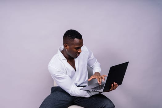 African American millennial businessman isolated on a studio background, successful male formal suit