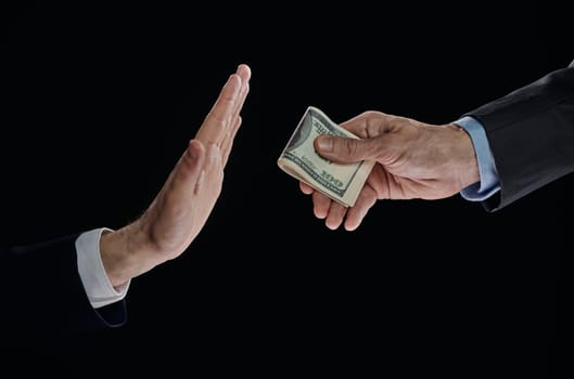 Hand Refuse Money from other Hand dollar, at Black Background