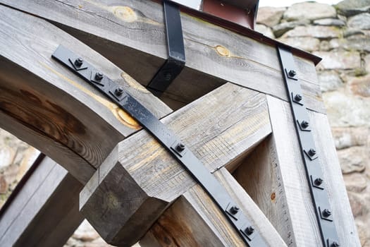 Photo of Old bridge construction parts with fastening metal elements