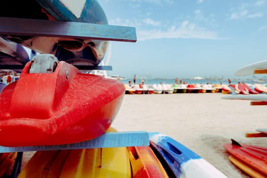 Surfboards stacked on the rack on a beach, close up