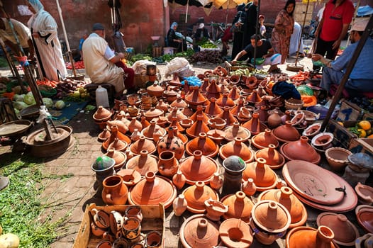 MARRAKECH, MOROCCO 09/08/2013 - Handmade brown clay tajins for food steaming arranged in rows ready for sell in Marrakesh