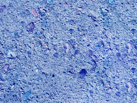 The texture of an old gray concrete wall..A close-up texture of plaster painted with blue paint.