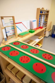 Classroom of Montessori kindergarten. The colorful Montessori material. Concept of children learning toy