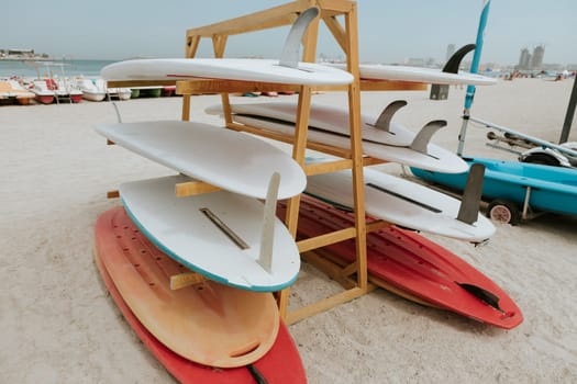 Surfboards stacked on the rack on a beach, close up