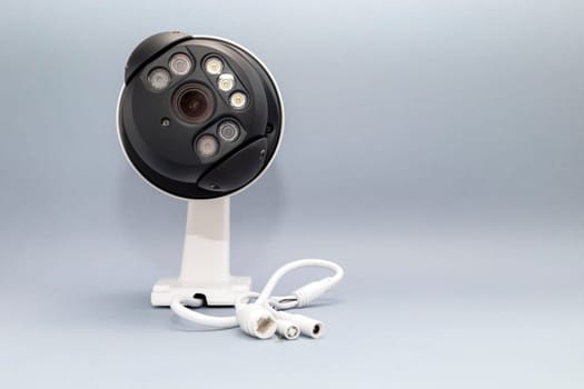 Mockup Alarm Security System, Intruder Video Monitoring, Surveillance Camera For Smart Home, House on Gray Background. Wifi Videcam, cctv. Copy Space for text, Horizontal plane. High quality photo