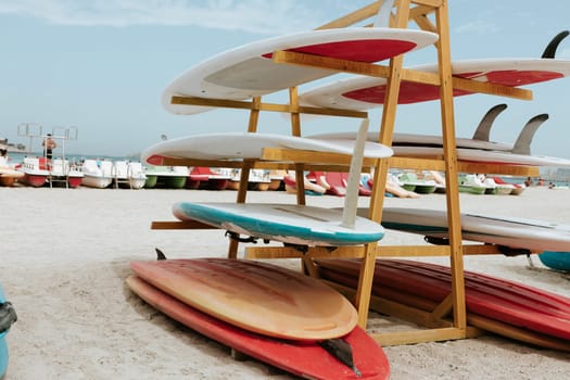 Surfboards stacked on the rack on a beach, close up