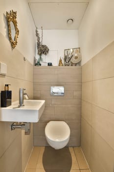 a small bathroom with a toilet, sink and mirror on the wall next to it is an open shower stall