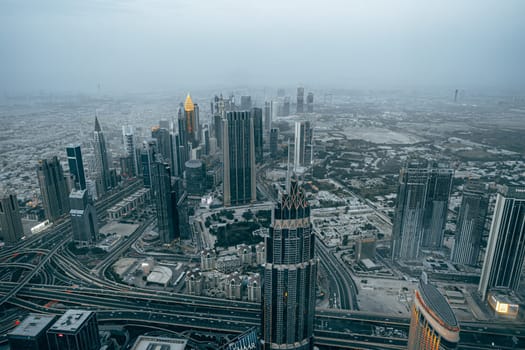 DUBAI, UAE - MARCH, 2021: At the top of Burj Khalifa, cityscape of Dubai, UAE