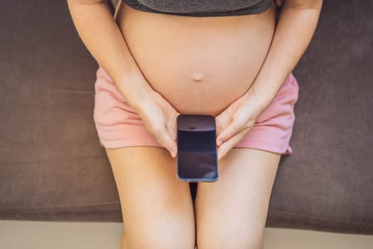 Pregnancy mockup app. Mobile pregnancy online maternity application. Pregnant mother using phone mock up. Pregnancy, medicine, pharmaceutics, health care and people concept.