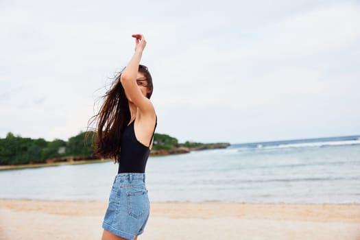 beach woman positive tan happy shore beauty body running lifestyle beautiful smiling vacation sunset young smile sea hair water travel summer