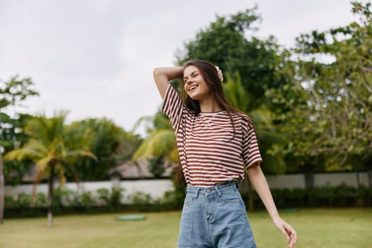 joy woman lifestyle fun freedom striped walking beautiful happy wellness female summer smiling walk hipster beauty quiet park person t-shirt nature