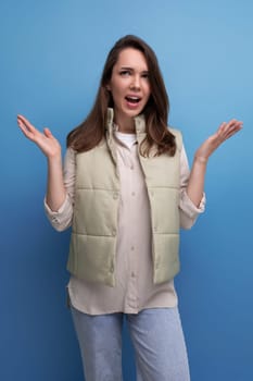 indignant brunette young woman in casual style in studio.
