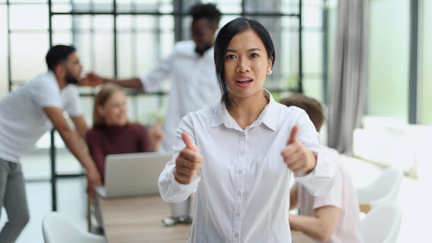 young successful businesswoman in white shirt smiling in the office