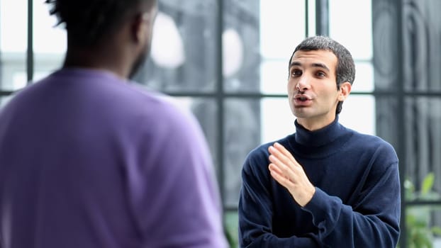 young african american and caucasian business people discussing common project work
