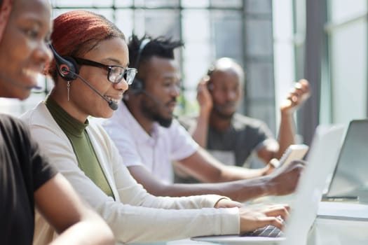 Call Center Operator With Colleagues At Workplace