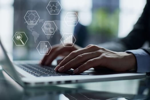man's hands typing on laptop keyboard in interior