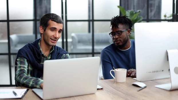 Businessmen working on laptop computer in the office