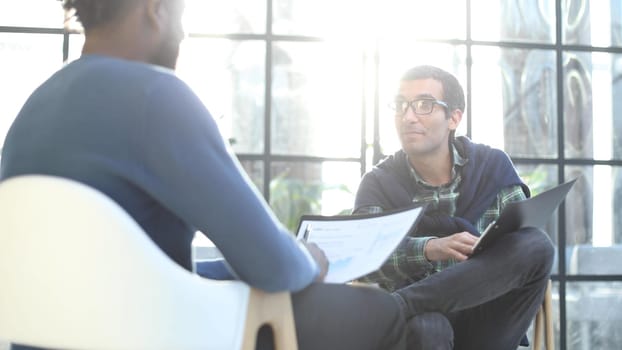 Positive young people fills in information in the questionnaire, applying for a job