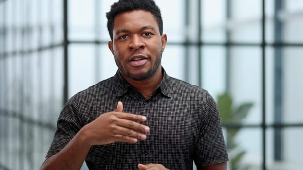 Indoor shot of a young confident black businessman looking serious
