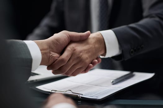 businessman shakes hands, making a deal with a lawyer. male judge legal