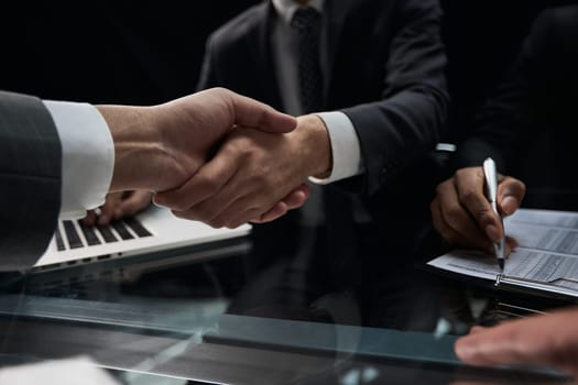 businessman shakes hands, making a deal with a lawyer. male judge legal