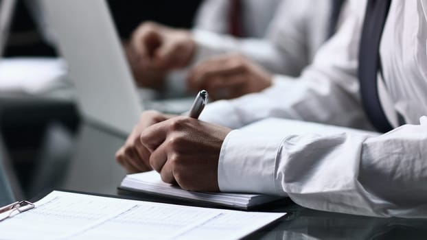 close-up of person filling out form or survey at office desk