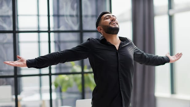 Achievement career wealth business concept. Mock up copy space. Clenching fists like winner.