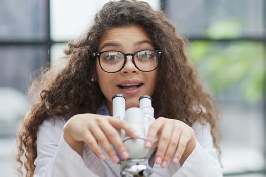 Female scientist researcher conducting an experiment in a labora