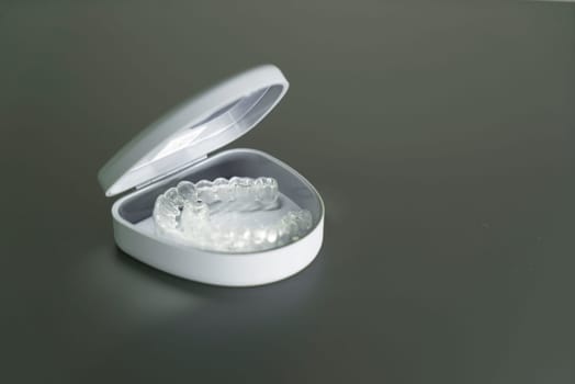 Dental aligner in box. Invisible orthodontic cosmetic brackets.