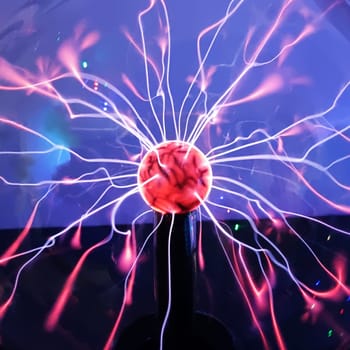 Tesla plasma ball with light beams inside, lightning effect, close-up