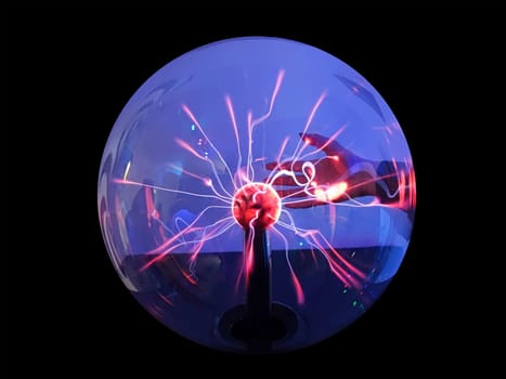 hand touches plasma tesla magic ball, isolate on black background.