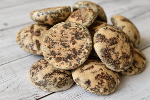 Heap of chocolate gingerbread on wooden background