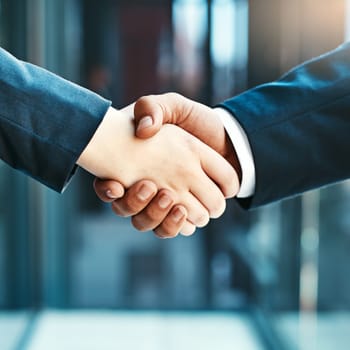 Handshake closeup, business people and collaboration, agreement and support with networking, welcome and introduction. Hiring, recruitment and promotion, corporate team shaking hands and partnership.