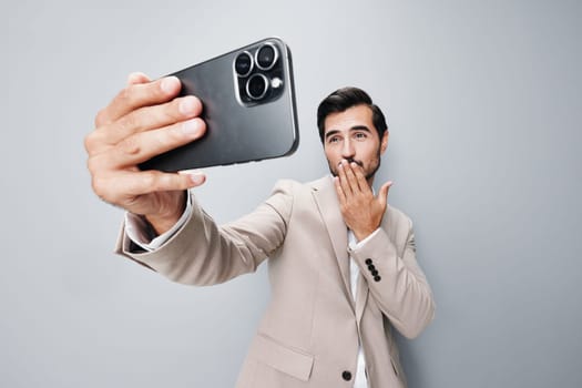 hold man holding isolated smartphone call communication portrait lifestyle smile beard phone suit selfies corporate handsome cellphone mobile business happy person